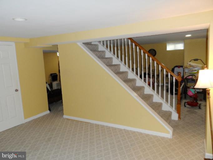 1934 Greengage Road Baltimore, MD 21244 - Photo 16 of 16 a view of a hallway with wooden floor and stairs
