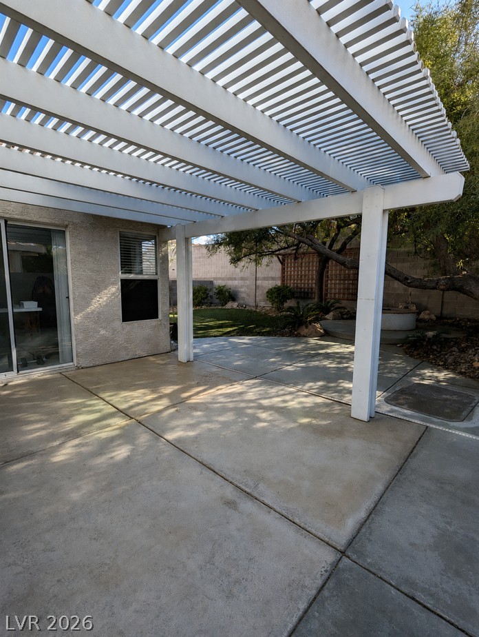 2407 Worchester Road Henderson, NV 89074 - Photo 5 of 5 A private backyard oasis features a shaded patio, perfect for enjoying sunny afternoons.