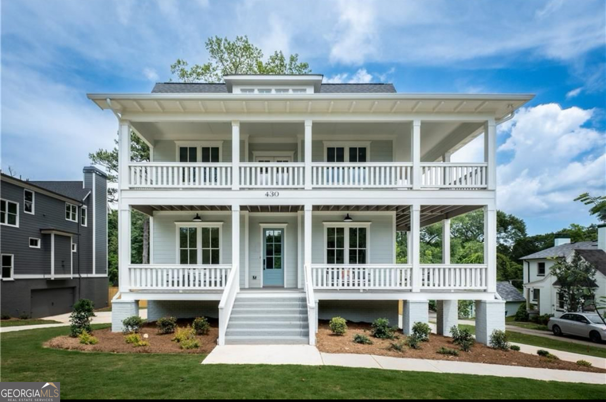 430 Allendale Drive Southeast Atlanta, GA 30317 - Photo 2 of 7 a view of an apartment with large windows and a yard