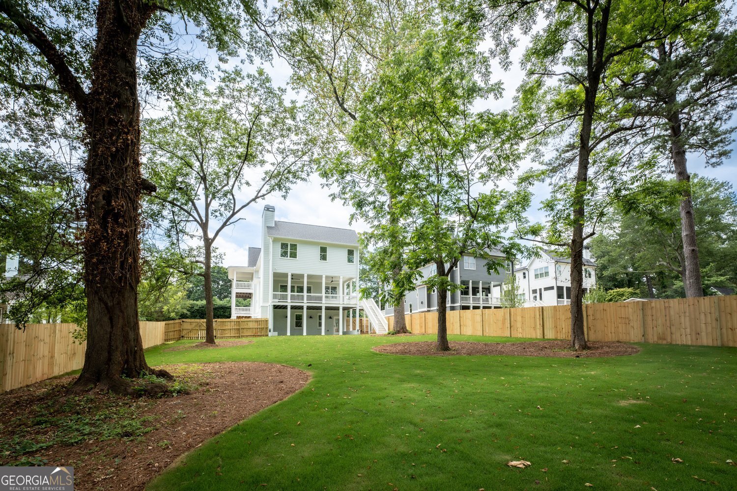 430 Allendale Drive Southeast Atlanta, GA 30317 - Photo 7 of 7 a view of a house with a big yard and large trees