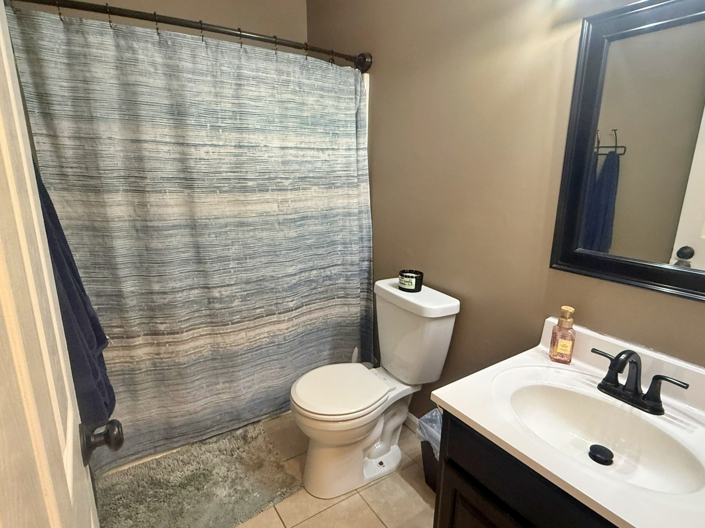 5012 Rosebud Road Metropolis, IL 62960 - Photo 40 of 44 a bathroom with a sink a toilet and a mirror