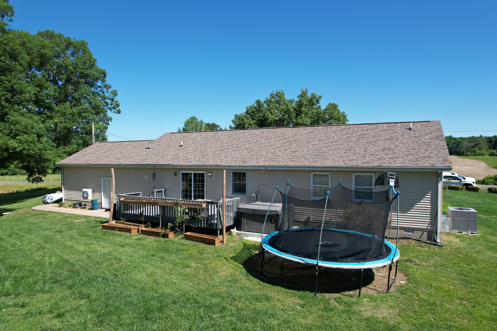 5012 Rosebud Road Metropolis, IL 62960 - Photo 4 of 44 a backyard of a house with fire pit barbeque oven and outdoor seating