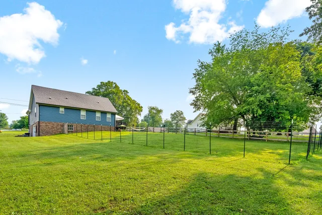 a view of a house with a big yard