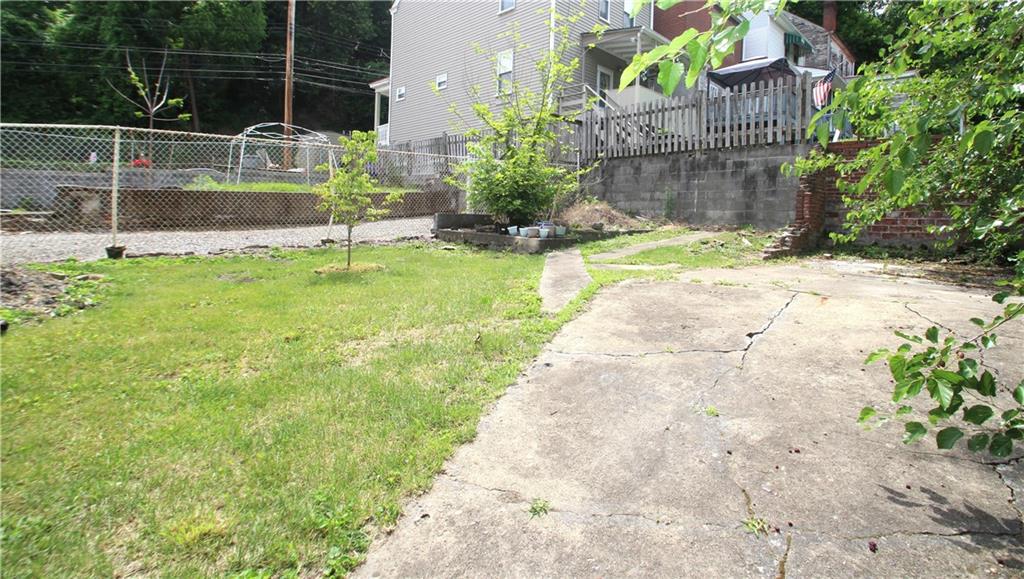 1406 Firth Street, Unit 1 Pittsburgh, PA 15212 - Photo 19 of 19 a view of backyard with wooden fence