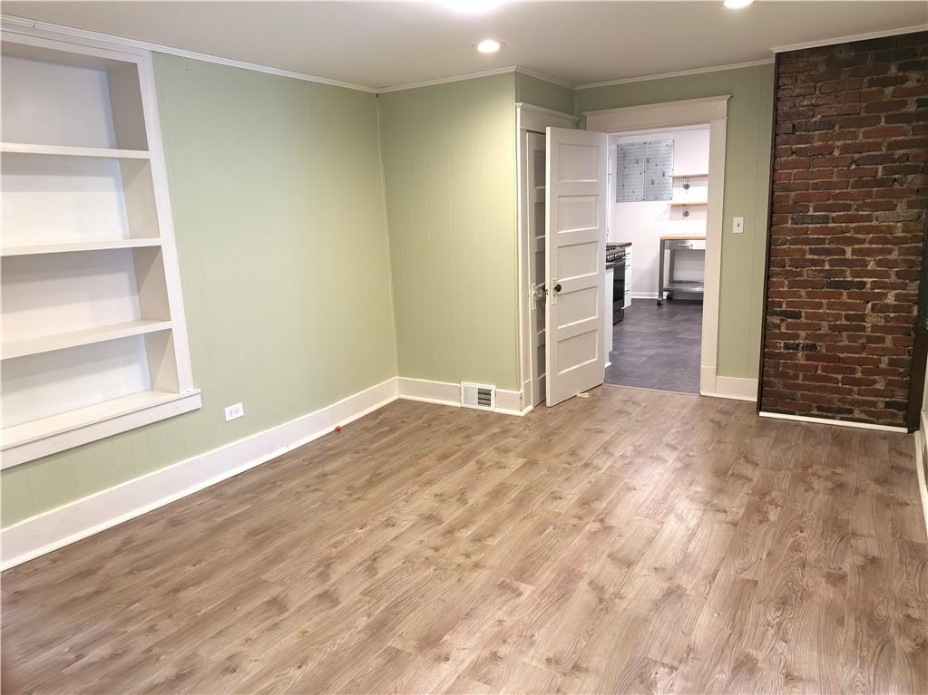 1406 Firth Street, Unit 1 Pittsburgh, PA 15212 - Photo 5 of 19 a view of a room with wooden floor and windows