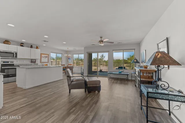 a living room with furniture and kitchen view
