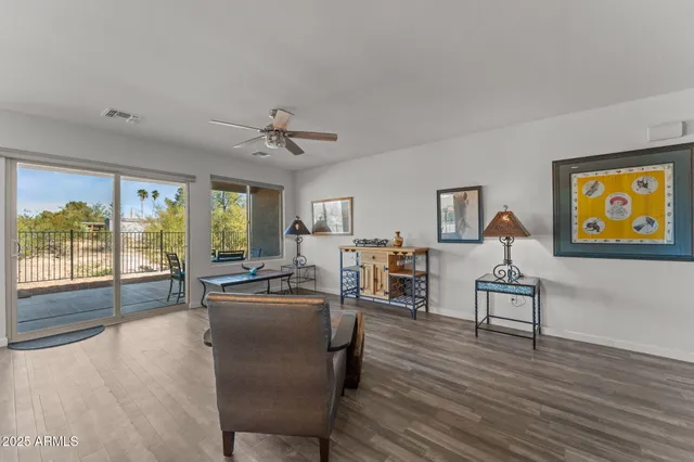a living room with furniture and large window
