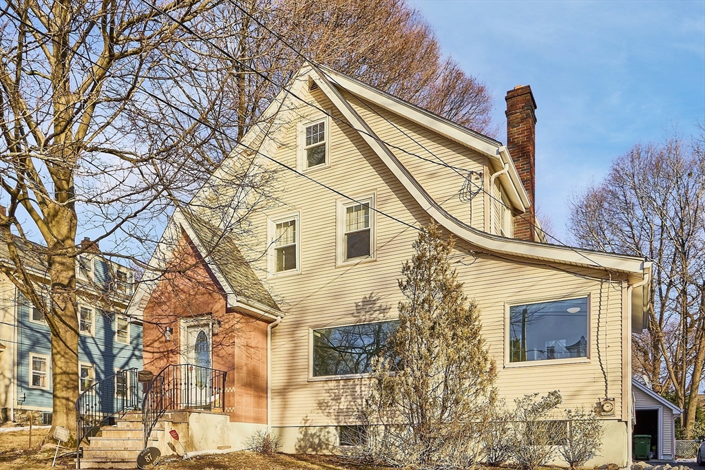 87 Common Street Watertown, MA 02472 - Photo 1 of 41 a front view of a house with a yard