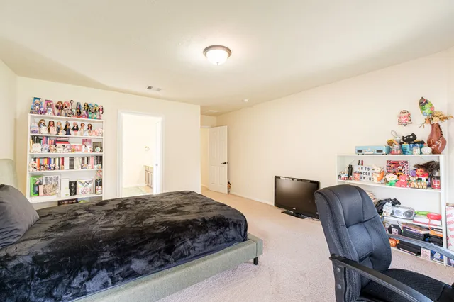 a bedroom with a bed and furniture