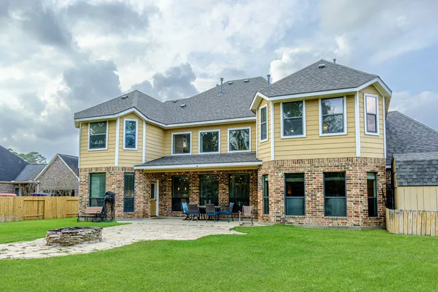 a front view of a house with a yard and yard