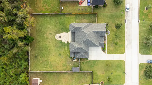 an aerial view of residential houses with outdoor space