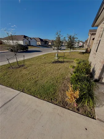 a view of a back yard of the house
