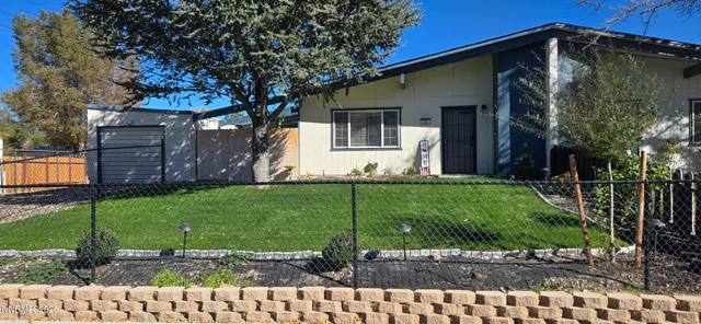 a view of a house with a back yard