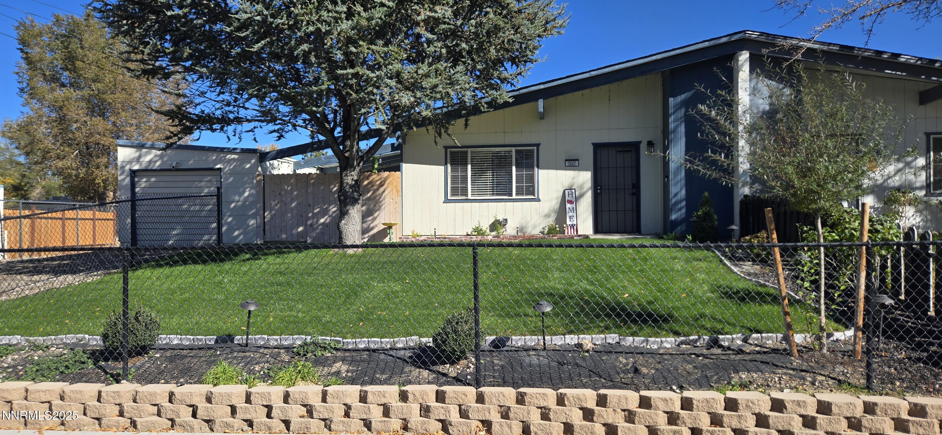 a view of a house with a back yard