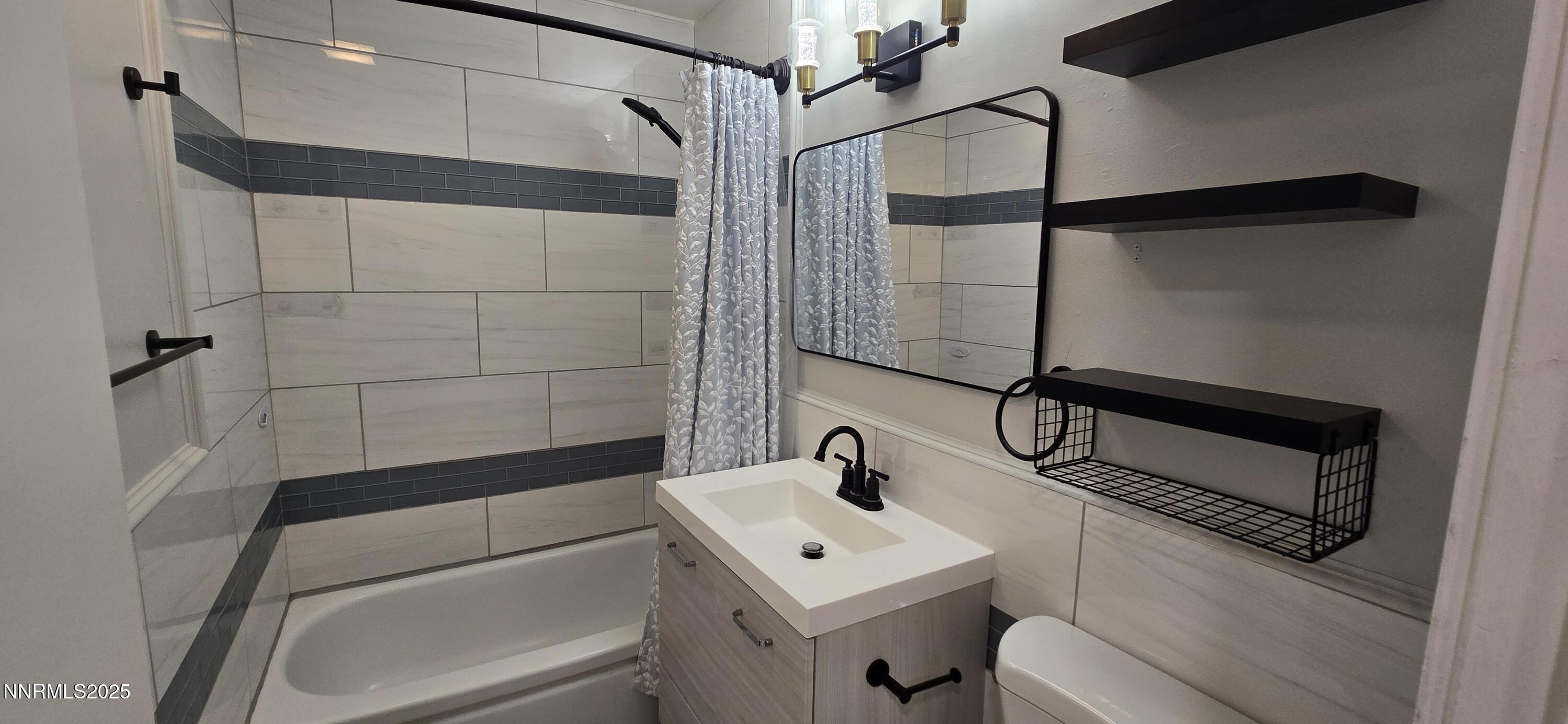 13562 Mt Baldy Street Reno, NV 89506 - Photo 6 of 9 a bathroom with a sink a toilet and shower