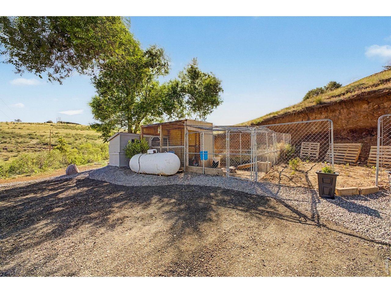 14500 Buckhorn Road Loveland, CO 80538 - Photo 21 of 34 Chicken coop, garden area and propane tank all included!