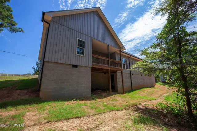 a backyard of a house with lots of green space