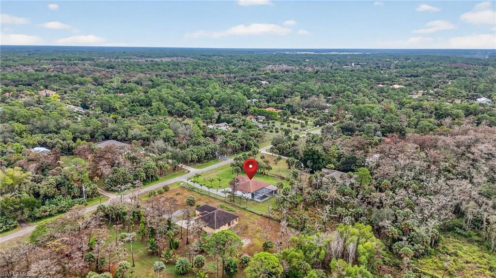 563 15th Street Northwest Naples, FL 34120 - Photo 33 of 33 Aerial overview of property's location with a heavily wooded area