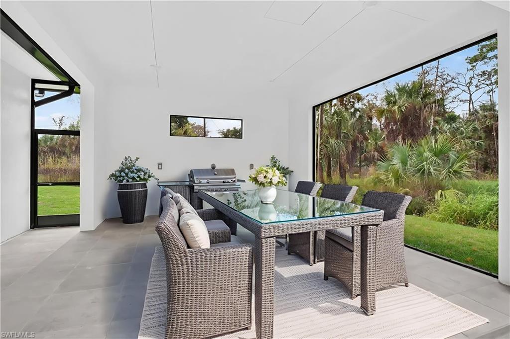 563 15th Street Northwest Naples, FL 34120 - Photo 7 of 33 Virtually Staged space with fittings for an outdoor kitchen