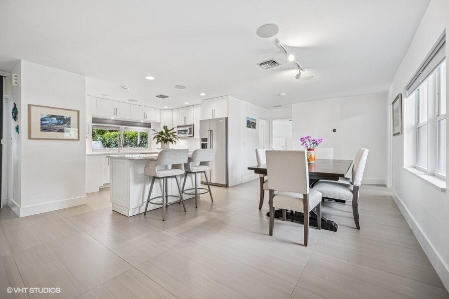 746 Southwest 2nd Street Boca Raton, FL 33486 - Photo 13 of 54 a dining room with furniture and window