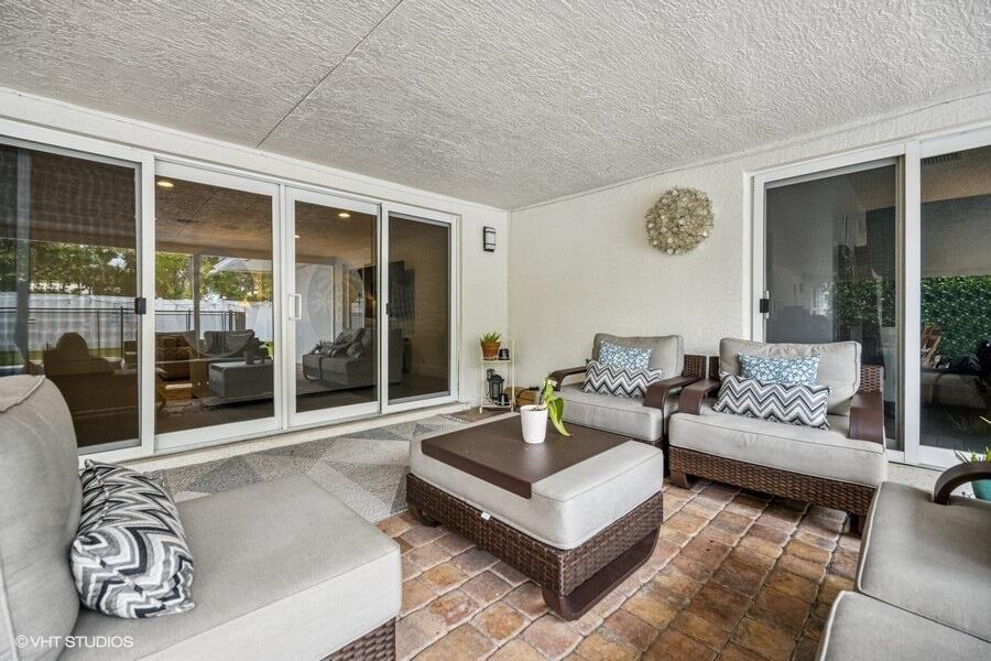 746 Southwest 2nd Street Boca Raton, FL 33486 - Photo 24 of 54 a living room with furniture and a large window