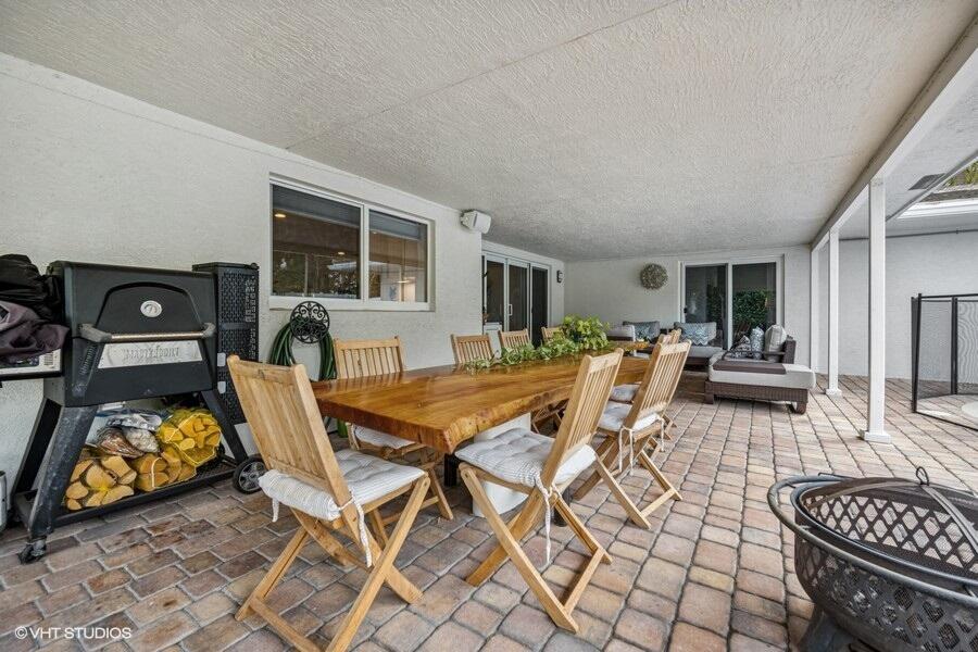 746 Southwest 2nd Street Boca Raton, FL 33486 - Photo 25 of 54 a dining room with furniture and wooden floor