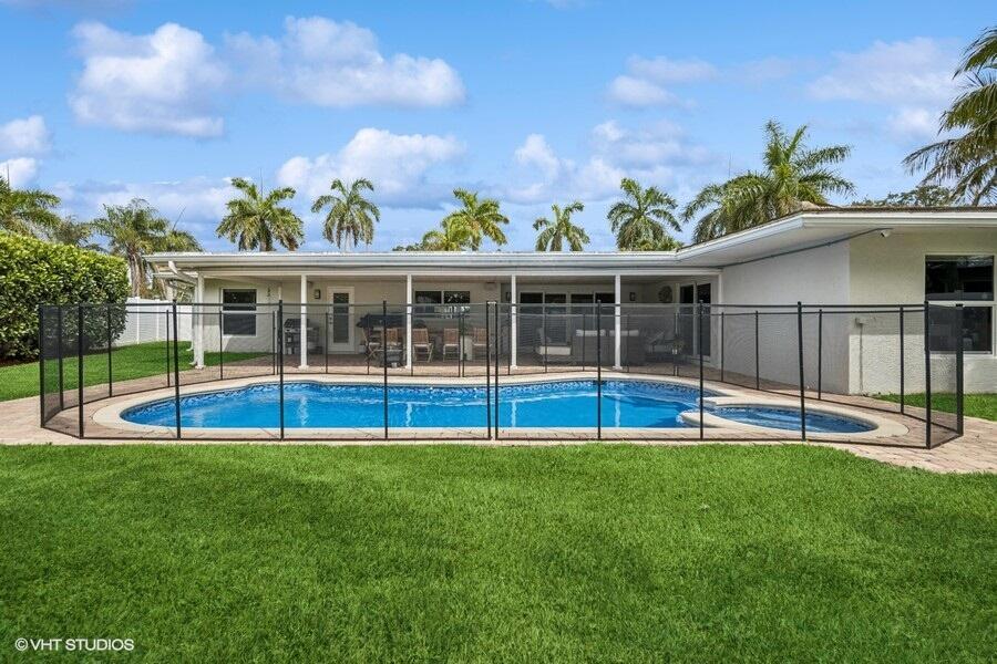 746 Southwest 2nd Street Boca Raton, FL 33486 - Photo 27 of 54 a view of an house with backyard and a swimming pool