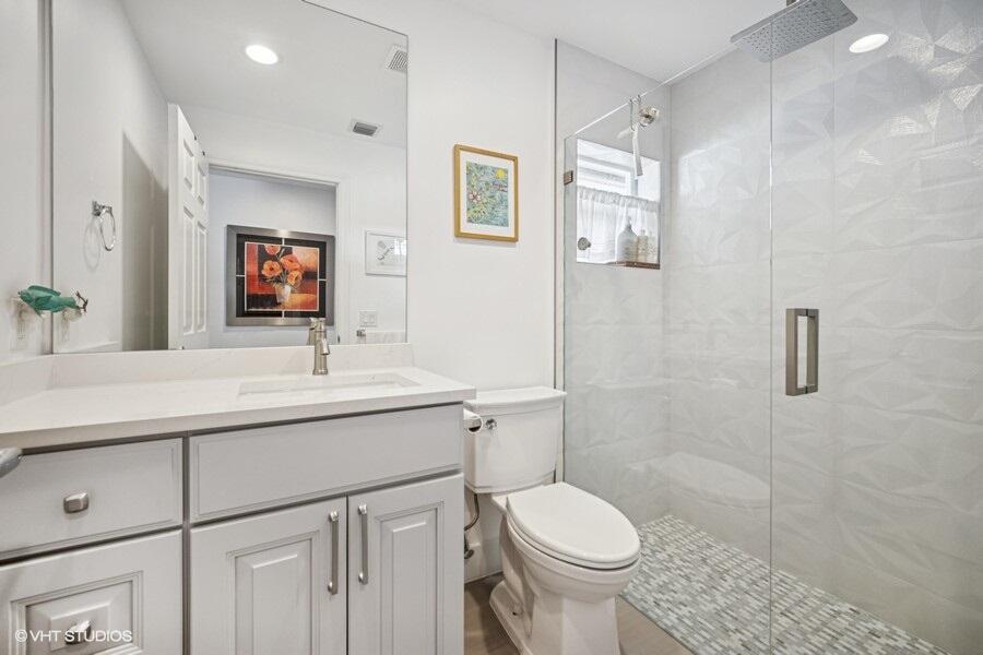 746 Southwest 2nd Street Boca Raton, FL 33486 - Photo 29 of 54 a bathroom with a sink toilet and shower