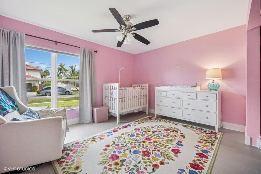 746 Southwest 2nd Street Boca Raton, FL 33486 - Photo 33 of 54 a living room with furniture and a bed
