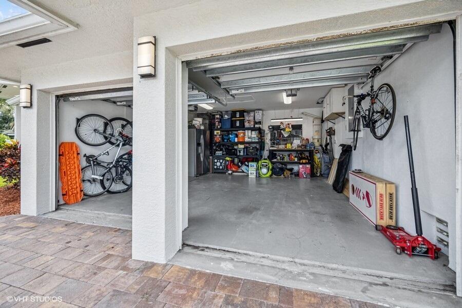 746 Southwest 2nd Street Boca Raton, FL 33486 - Photo 34 of 54 a view of a garage with rack and bicycle