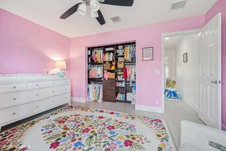 746 Southwest 2nd Street Boca Raton, FL 33486 - Photo 35 of 54 a bed room with a bed and a dresser