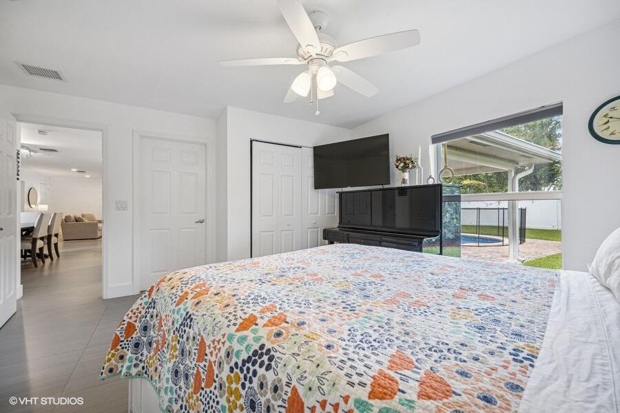 746 Southwest 2nd Street Boca Raton, FL 33486 - Photo 38 of 54 a bedroom with a bed and a television