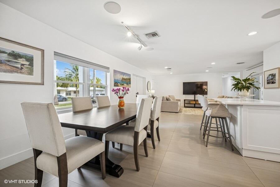 746 Southwest 2nd Street Boca Raton, FL 33486 - Photo 6 of 54 a view of a dining room with furniture and a large window