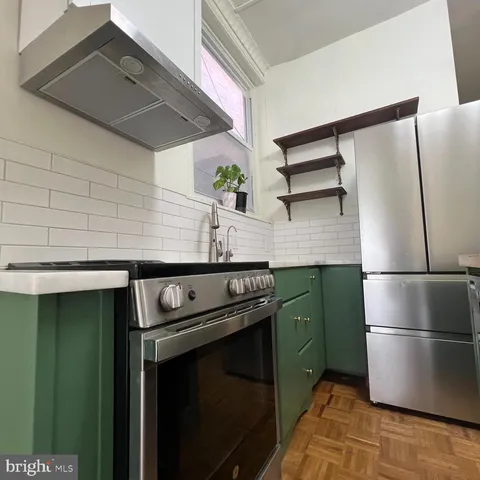 a bathroom with a sink toilet and a mirror
