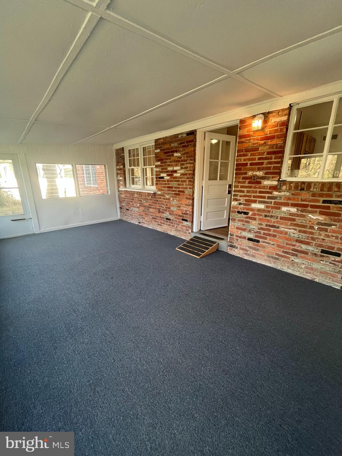 7908 Wellington Road Alexandria, VA 22308 - Photo 15 of 16 a view of a livingroom with wooden floor and a window