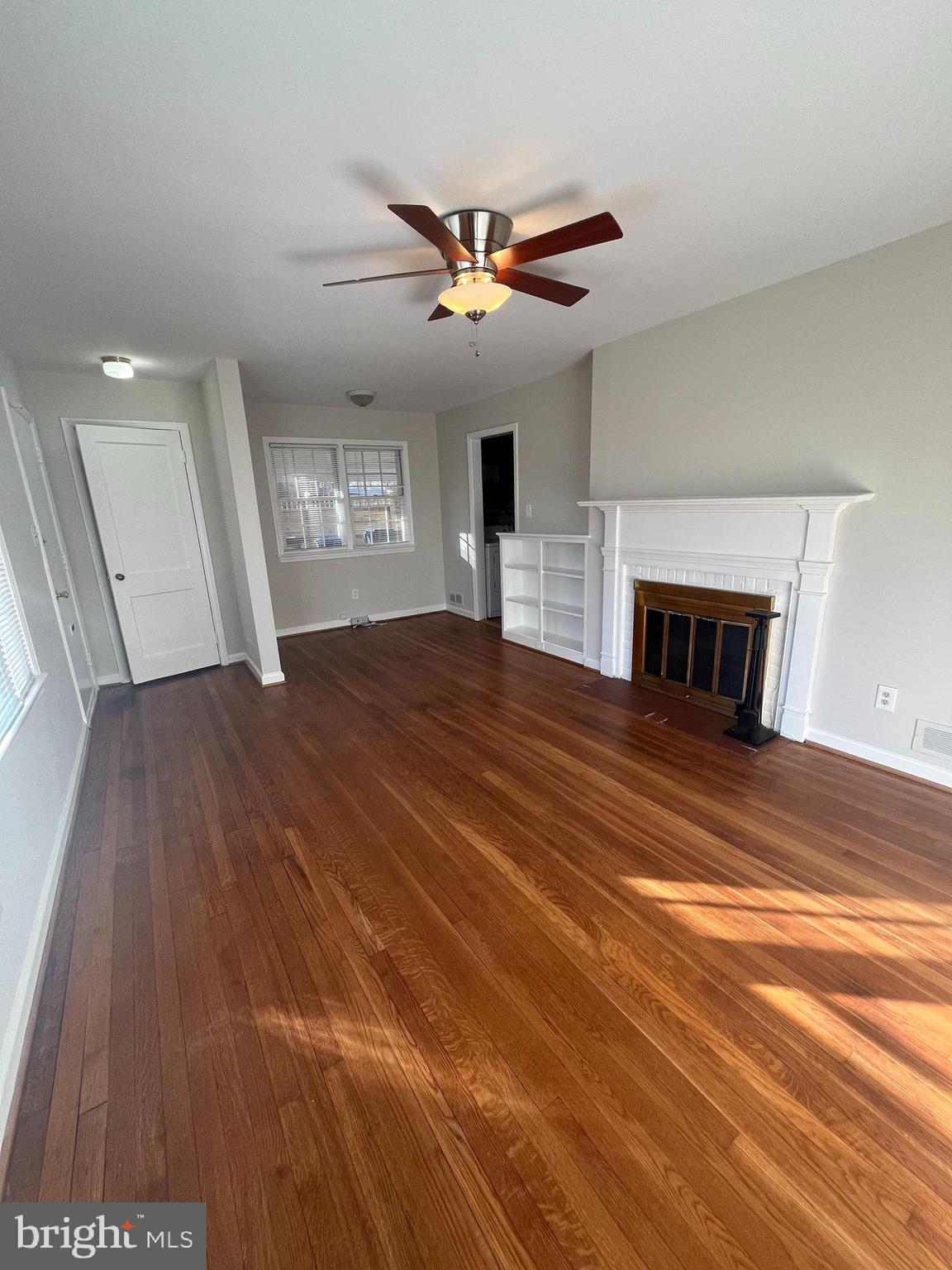 7908 Wellington Road Alexandria, VA 22308 - Photo 3 of 16 a view of empty room with fan and window