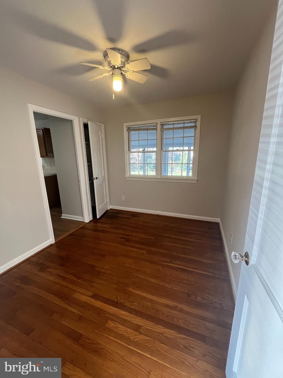 7908 Wellington Road Alexandria, VA 22308 - Photo 9 of 16 a view of empty room with window and wooden floor