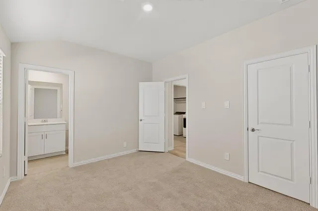 a view of an empty room and closet area