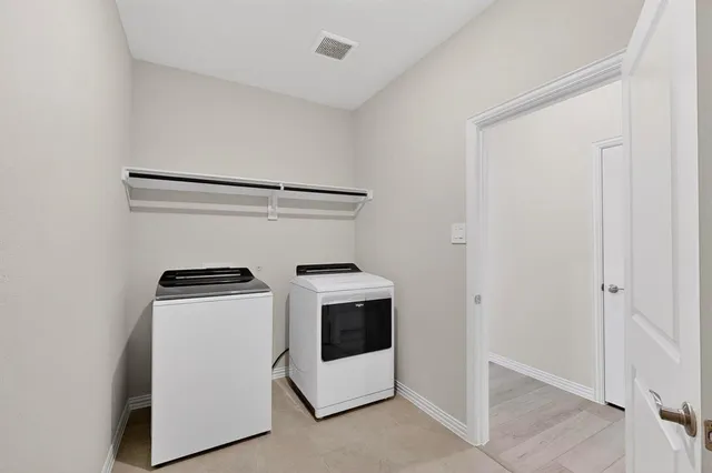 a utility room with dryer and washer