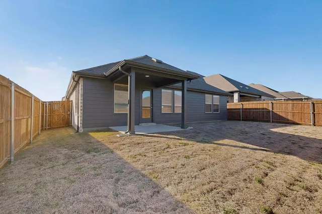 a house with trees in the background