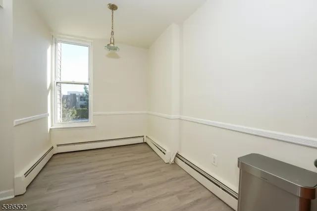 a view of a room with a large window