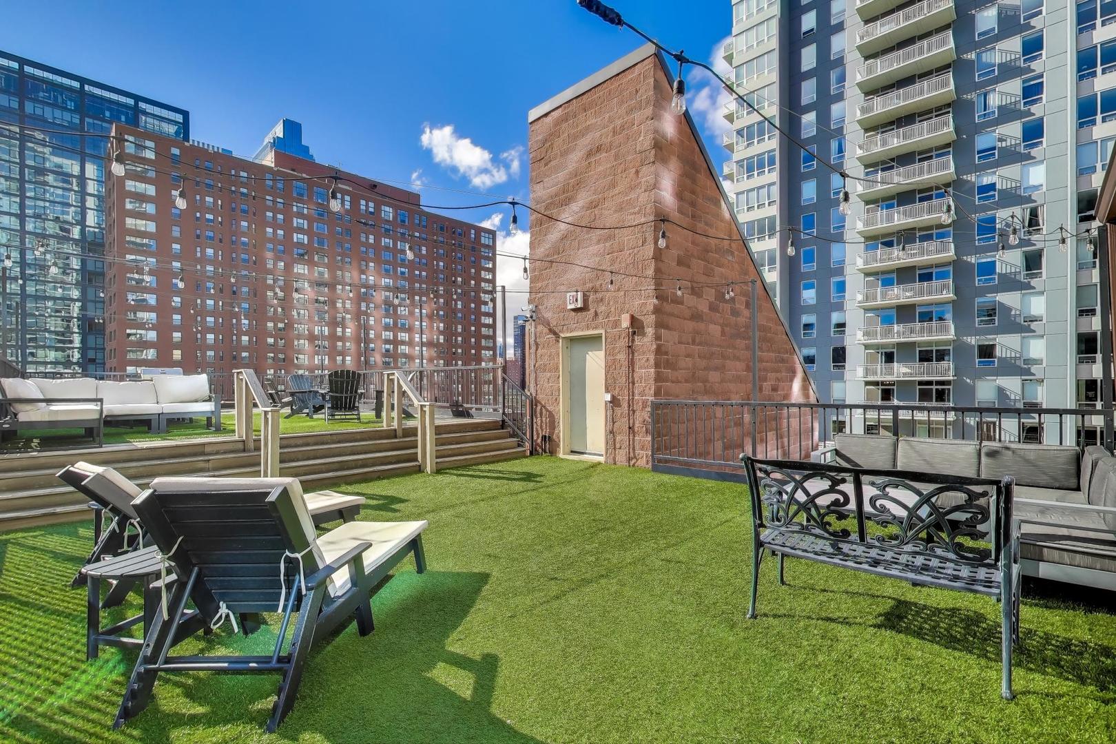 300 West Grand Avenue, Unit 210 Chicago, IL 60654 - Photo 17 of 20 a view of a building with a yard