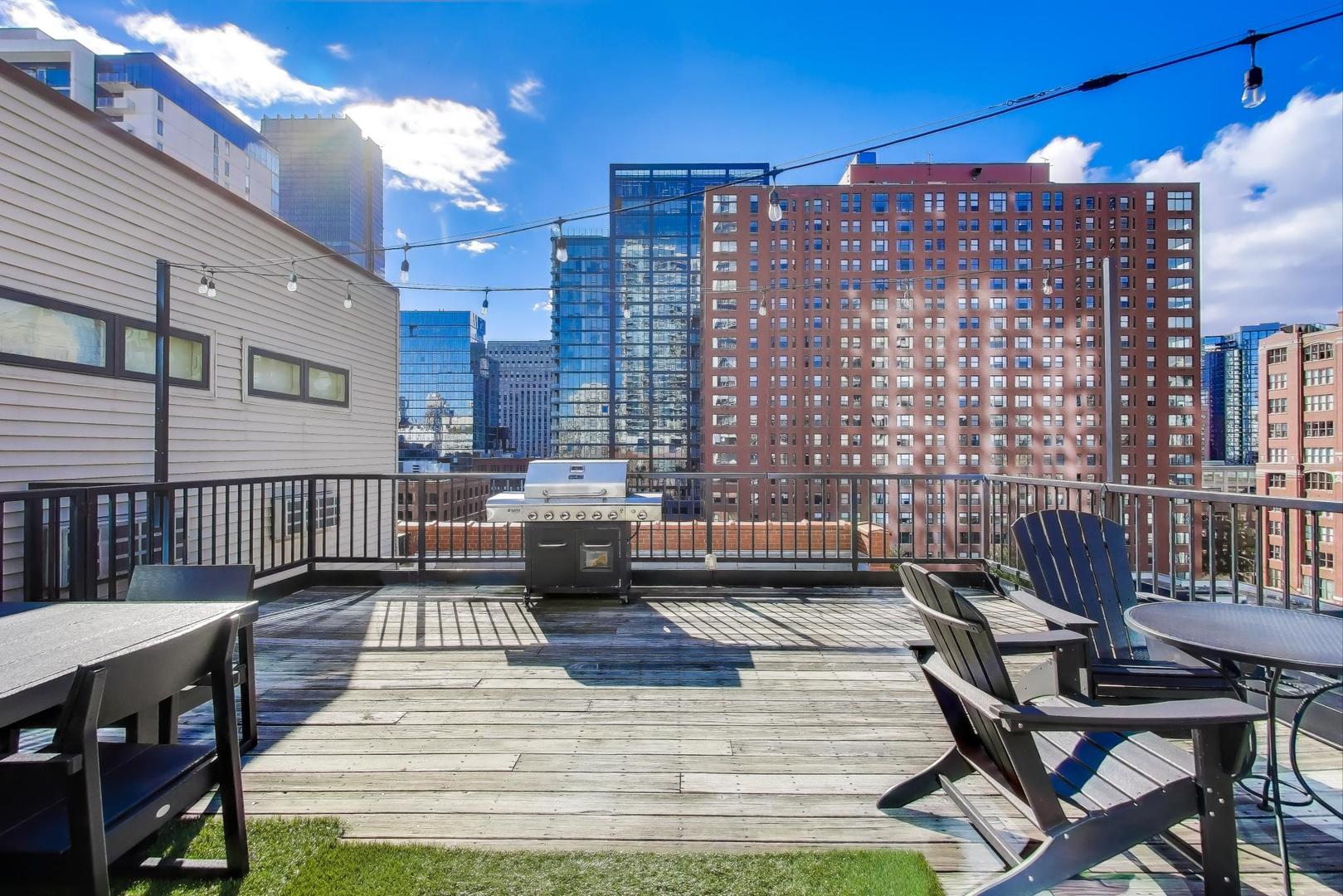 300 West Grand Avenue, Unit 210 Chicago, IL 60654 - Photo 18 of 20 a view of a balcony with chairs