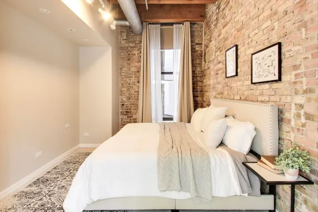 a bedroom with a bed and a couch