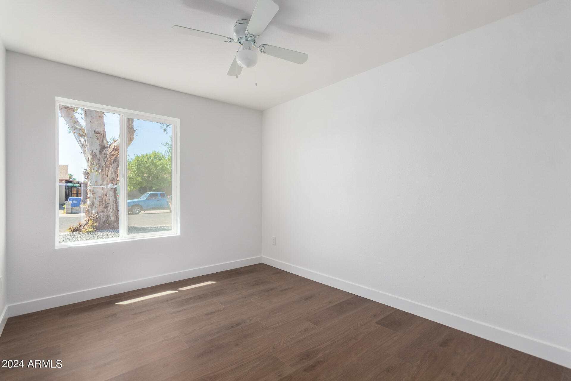 5338 West Coronado Road Phoenix, AZ 85035 - Photo 15 of 29 an empty room with a window