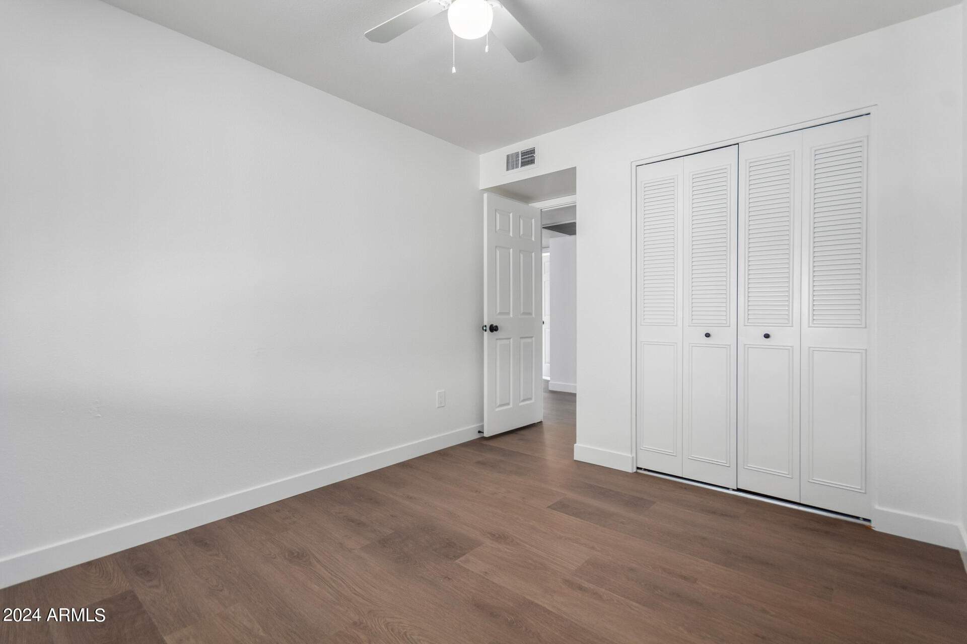 5338 West Coronado Road Phoenix, AZ 85035 - Photo 18 of 29 wooden floor in an empty room