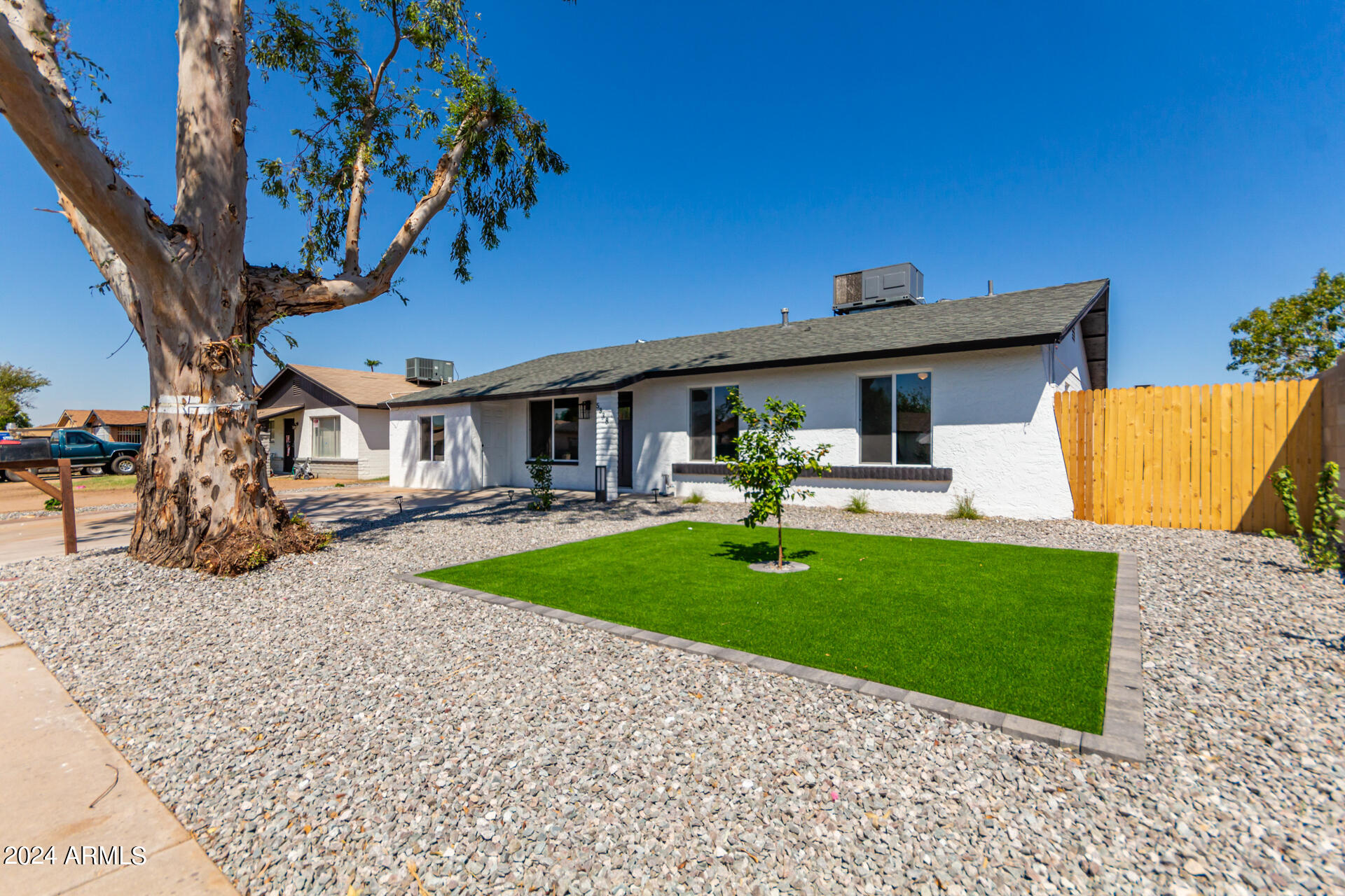 5338 West Coronado Road Phoenix, AZ 85035 - Photo 2 of 29 a front view of a house with a yard