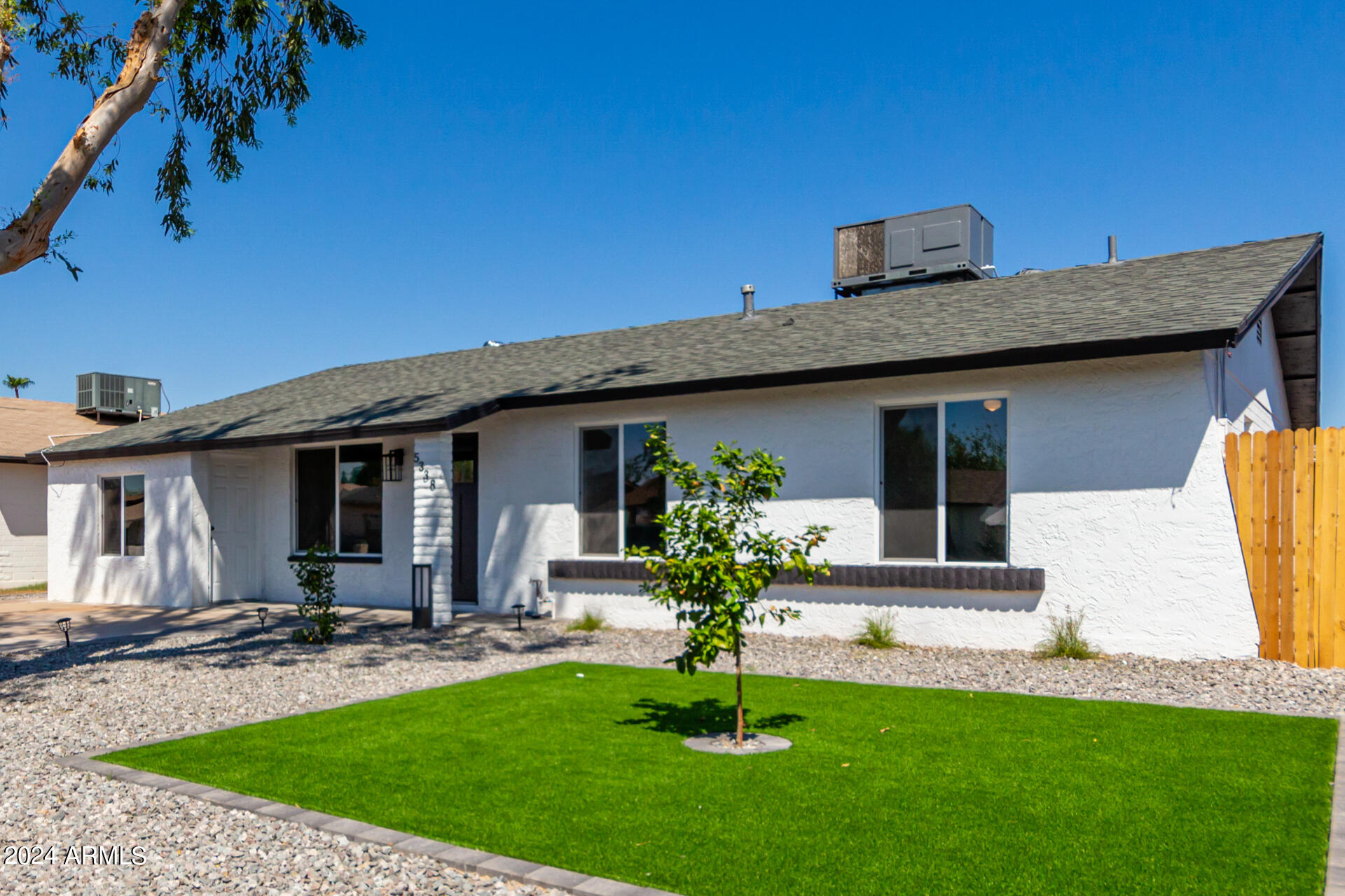 5338 West Coronado Road Phoenix, AZ 85035 - Photo 3 of 29 a front view of a house with a yard