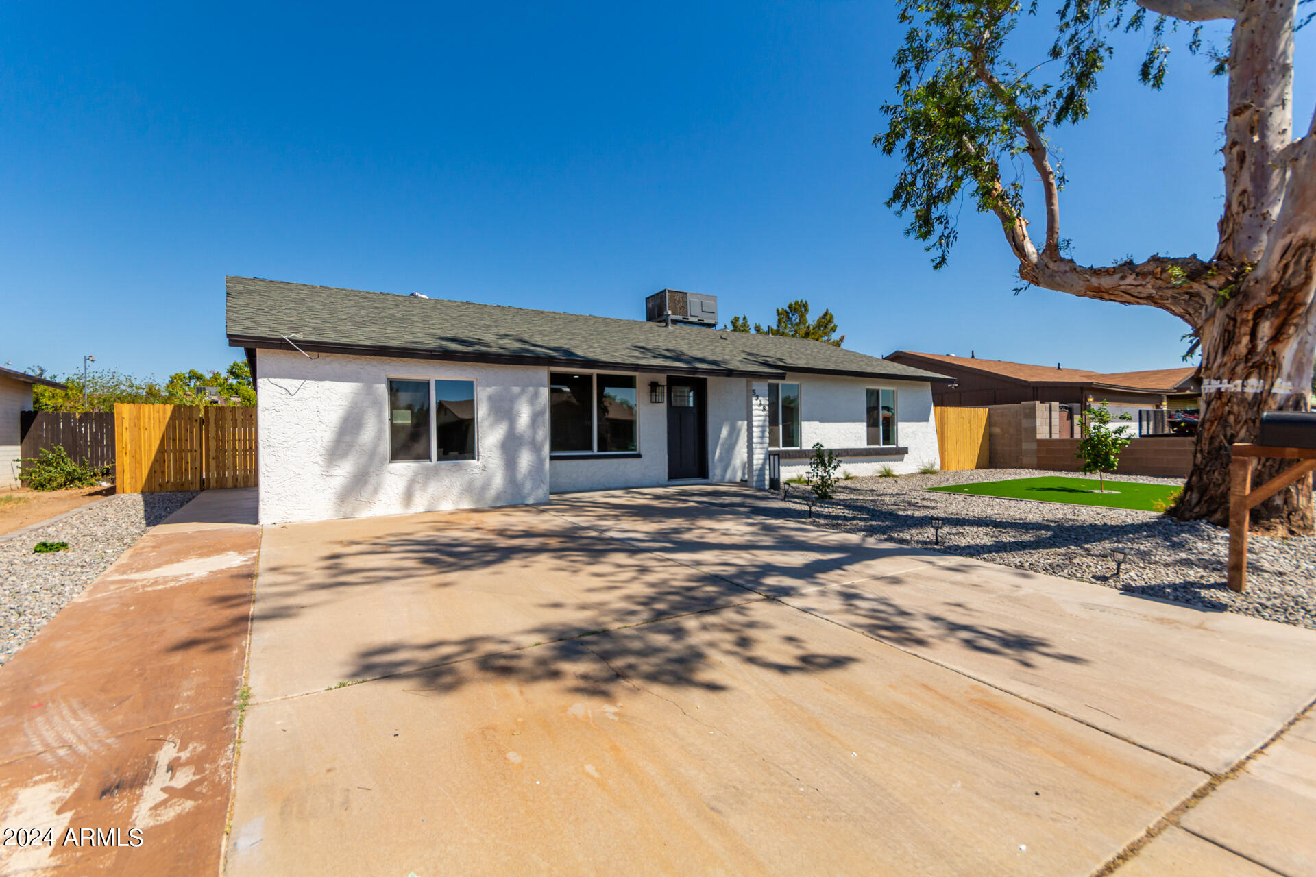 5338 West Coronado Road Phoenix, AZ 85035 - Photo 5 of 29 a front view of a house with a garden