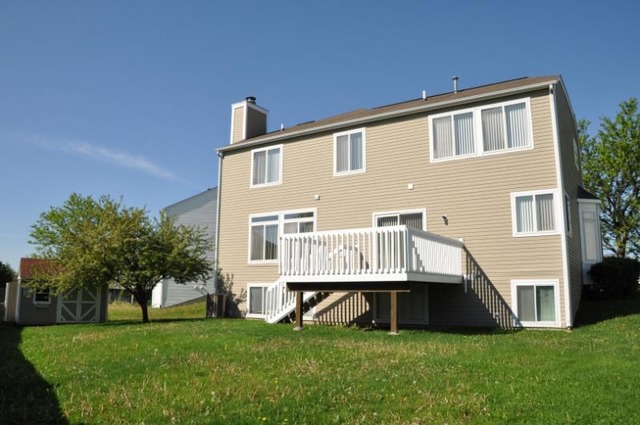 2205 Clipper Court Elgin, IL 60123 - Photo 19 of 24 a backyard of a house with table and chairs